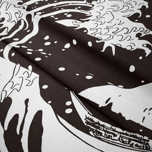 Detailed close-up showing texture and Japanese wave print on black and white tapestry fabric