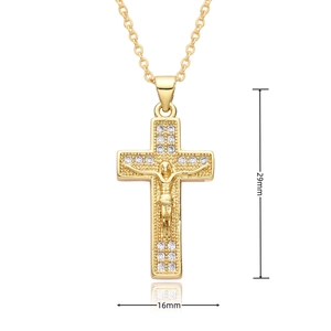 Detail view of 29mm x 16mm gold cross pendant with white rhinestones and Jesus relief