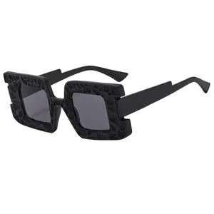 Modern oversized square sunglasses with matte black honeycomb textured frame and wide temples