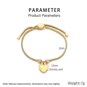 Detail of 18K gold plated heart charm on a 2mm stainless steel snake bone chain bracelet