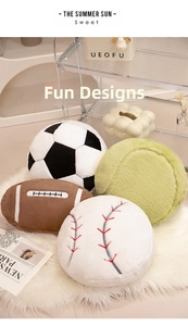Plush sports ball pillows including soccer, rugby, baseball, and tennis designs on carpet