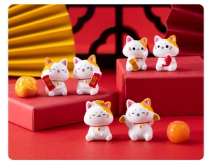 Set of six mini resin lucky cats on red gift box with traditional Chinese decor