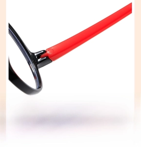 Detail of sturdy hinge on black and red kids glasses for smooth and comfortable wear