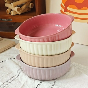 Set of four stackable ceramic bowls with handles and vertical textures in pastel colors