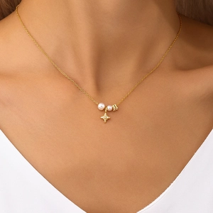 Close-up of golden S925 silver necklace featuring elegant pearl and sparkling star pendant