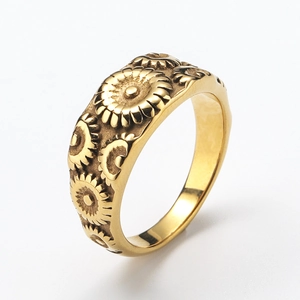 Gold vintage stainless steel ring with sunflower embossing shown from 45-degree angle