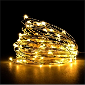 Detail of warm white copper wire LED fairy lights powered by battery for Christmas trees