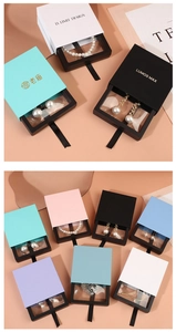 Macro shot of jewelry drawer display boxes with PE film and colorful sliding outer cases