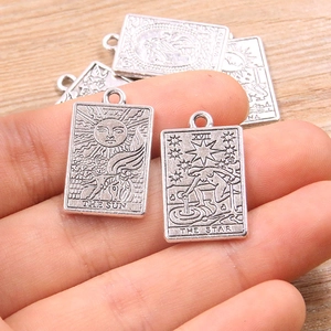 Zinc alloy tarot card pendants including The Sun and The Star designs in antique silver