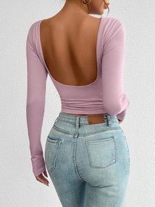 Detail view of pink long-sleeve knit top featuring a stylish open back design for women