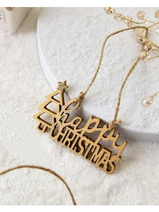 Detail of wooden Happy Christmas hanging sign with natural texture and hemp rope