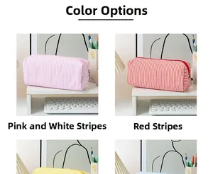 Detailed color options of striped seersucker pencil cases in pink, red, yellow and blue