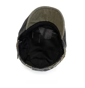 Gros plan d'une casquette plate vintage avec doublure en filet noir et étiquette cousue