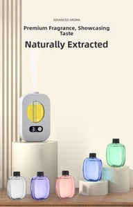 White smart aroma diffuser set with six colorful essential oil bottles and digital display