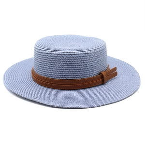 Flat top straw boater hat in light blue with brown faux leather band and bow decoration