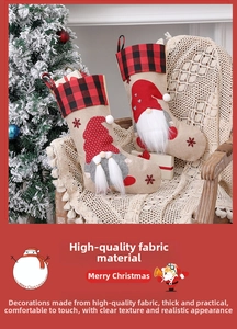 Detail of Christmas stockings with gnome patterns and buffalo plaid trim on a chair