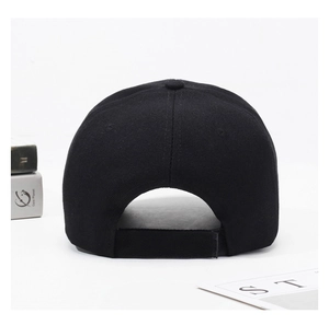 Detail view of black cotton baseball cap showing adjustable velcro strap and premium stitching