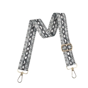 Adjustable black and white snakeskin print shoulder strap with gold metal hooks