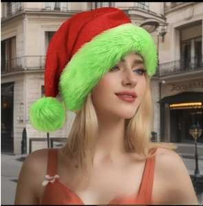 Detail of red plush Christmas hat with fluorescent green fur trim worn by a model