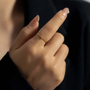 Minimalist gold-plated sterling silver bead ring featuring a sparkling zircon stone