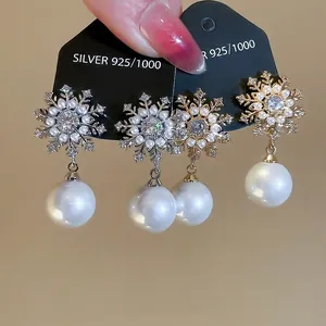 Elegant S925 silver needle snowflake pearl drop earrings in gold and silver finish