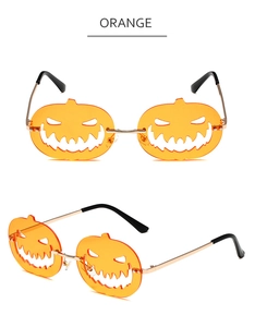 Detail of orange pumpkin shaped lenses with gold metal temples for Halloween sunglasses