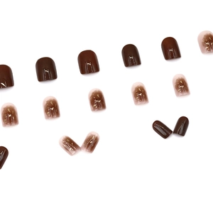 Short square press-on nails in coffee brown and gradient nude with gold foil accents