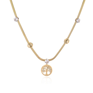 Detailed view of gold-plated tree of life pendants and zircon charms on a snake chain
