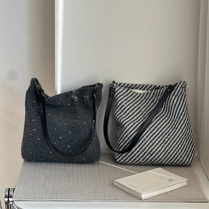 Elegant tweed tote bags in grey polka dot and black twill with leather straps