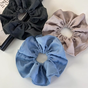Three premium pleated cotton fabric scrunchies in black, light brown, and sky blue colors