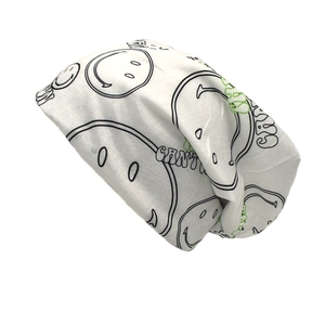 White graffiti beanie with smiley faces and Cant Stop lettering for autumn street style