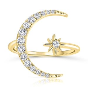 Macro detail of gold adjustable ring featuring a pavé diamond moon and star design