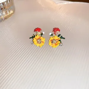 Floral stud earrings with colorful oil drip enamel and sparkling crystal details
