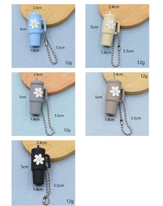 Detailed dimensions of five colorful 5cm mini cup keychains with floral daisy designs