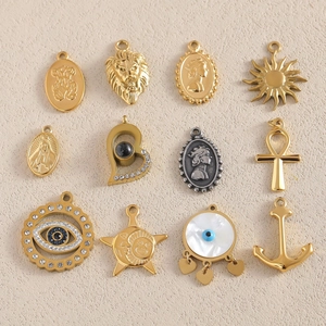 Assorted gold and silver stainless steel pendants featuring sun, evil eye and heart charms