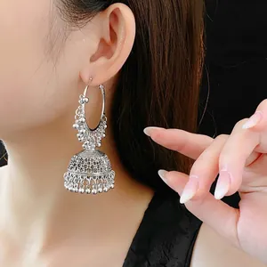 Ethnic silver hollow Jhumka earrings with vintage round hoops and bead tassel detail