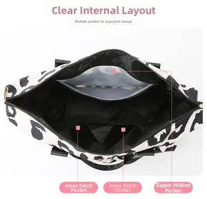 Internal view of cow print travel bag featuring zipper pocket and lining detail