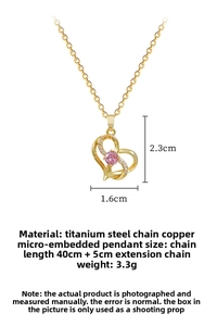 Detail of titanium steel gold chain with a heart pendant featuring pink gemstone