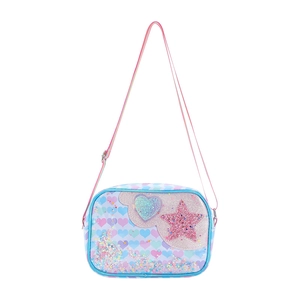 Close-up of glitter heart and star sequins on a pastel gradient unicorn bag