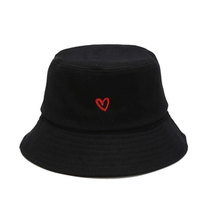 Classic black cotton bucket hat with detailed red heart embroidery on a white background