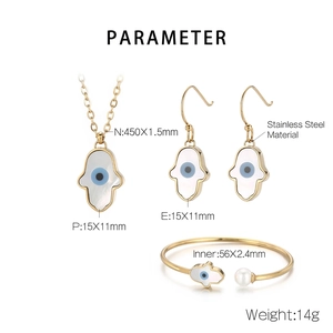 Gold Hamsa Hand jewelry set with shell and evil eye motif on stainless steel