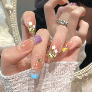 Detailed view of handmade press-on nails with 3D tulip patterns and gradient cat-eye effect