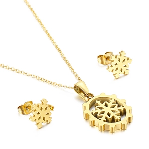 Golden snowflake pendant necklace and earrings set made of polished stainless steel