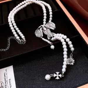 Vintage double-layer pearl necklace with eagle pendant and silver flower charms