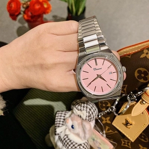 Detailed view of women's silver steel watch featuring a pink dial and date calendar display