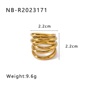 Detail of gold geometric spiral ring measuring 2.2cm in height and weighing 9.6g
