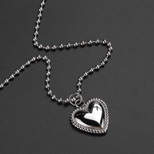 Retro titanium steel double-layered heart pendant necklace with beaded edge details