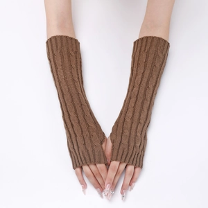 Detail of chunky cable knit texture on brown fingerless gloves with long arm warmers