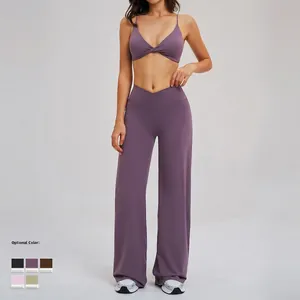 Women's deep purple flared yoga set with cross-waist sports bra and high-rise gym pants