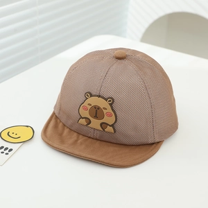 Detail of breathable mesh fabric and cartoon capybara patch on baby summer sun hat